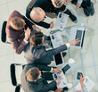 © yurolaitsalbert - top view. working group discussing financial reports at an office meeting .