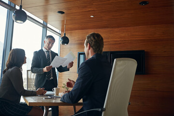 Aufkleber - They meet regularly to stay on the same page. a team of professionals having a meeting in a boardroom.