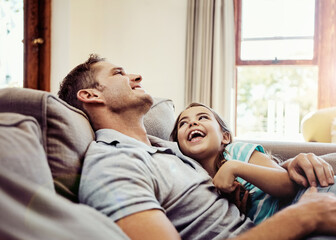 Canvas Print - Dads the one shell always look up to. a father and his little daughter bonding together at home.