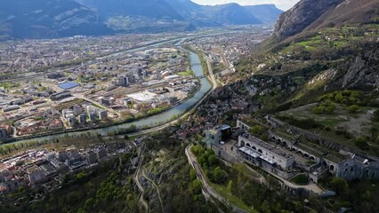 Wall Mural - Aerial drone view from above Fort de La Bastille on the panorama of Grenoble - France, French Alps, Auvergne-Rhone-Alpes Region