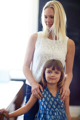 Wall Mural - Just us girls today. a happy mother and daughter spending quality time together at home.