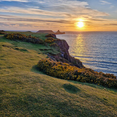 Canvas Print - Wales Swansea, UK. Dragon's Rest: A Majestic Worm's Head Sunset in Wales.