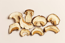 Minimal Food Pattern Beige Monochrome Colors From Dried Slices Of Porcini, Dehydrated Food Boletus Mushrooms, Top View, Aesthetic Texture Flat Lay. Natural Forest White Mushroom, Healthy Eating