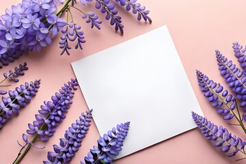 Wall Mural - Top view of Violet Chinese wisteria flowers and blank note paper isolated on pastel spring background with copy space