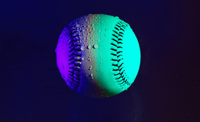 Wall Mural - Neon light on baseball ball closeup for pop art style baseball with water on it for rain game concept.