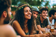 a young adult woman is happy and content, hippie relax look, smiling facial expression, outdoors with large group or friends, sometime temperatures, fictional location. Generative AI