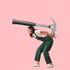 Sticker - Female worker with big heavy hammer on pink background