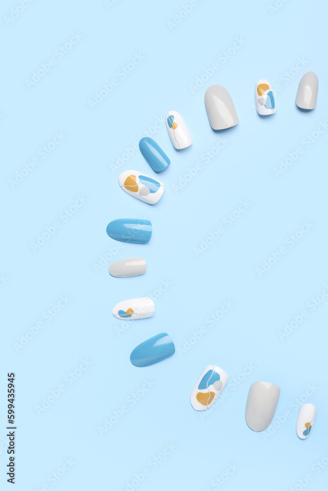 Press-on nails on blue background