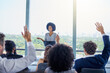 © Arnell Koegelenberg/peopleimages.com - Ill take your questions now. a young businesswoman answering questions during a presentation in an office.