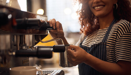 Aufkleber - One cup of magic, coming right up. Closeup shot of a barista operating a coffee machine in a cafe.