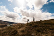2 men hiking down from Cervidae Peak in Boise Idaho 