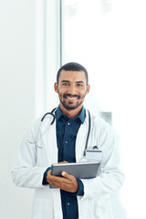 Aufkleber - Theres always something new to learn about medicine. Portrait of a young doctor using a digital tablet in a modern hospital.