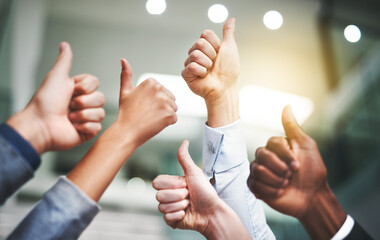 Poster - Keep up the amazing work. Closeup shot of a group of unrecognisable businesspeople showing thumbs up in an office.
