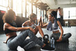 © Delmaine D/peopleimages.com - You go girl. young women giving each other a high five while taking a break at the gym.