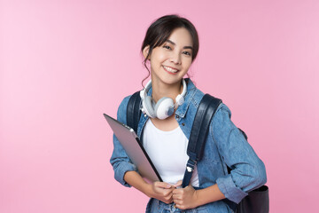 Wall Mural - Portrait of young Asian woman student standing with smartphone coffee and backpack.College Teenager University concept.