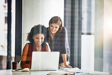Poster - Clutching every proimsing opportunity that comes their way. two businesswomen working together on a laptop in an office.
