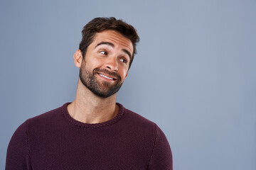 Aufkleber - Well, would you look at that. Studio shot of a handsome and happy young man looking thoughtful against a gray background.