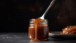 salted caramel with spoon from glass jar at table, closeup, generative AI tools 