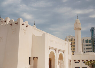 Wall Mural - Travel to Abu Dhabi in UAE. contrast between modern architecture and traditional mosques