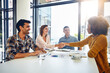 © Reese/peopleimages.com - Combining their expertise to deliver excellence. two designers shaking hands during a meeting in an office.