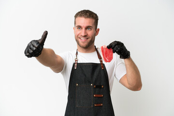 Canvas Print - Butcher caucasian man wearing an apron and serving fresh cut meat isolated on white background giving a thumbs up gesture