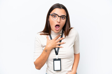 Wall Mural - Young caucasian woman with ID card isolated on white background surprised and shocked while looking right