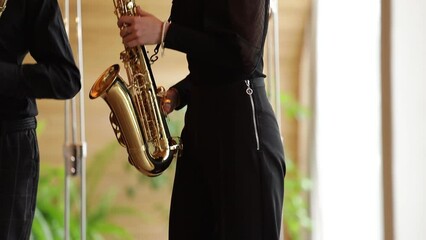 Poster - musician in black suit playing the saxophone