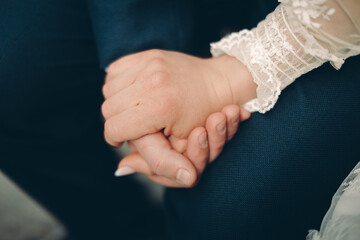 Poster - close up of a couple holding hands together