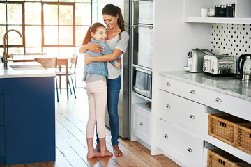 Wall Mural - Meaningful moments with mom. Portrait of a happy mother and daughter in a loving embrace at home.