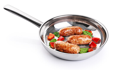 Poster - Sausages with sweet pepper and spinach fried in a stainless steel pan. With clipping path.