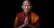Buddhist monks meditate to calm the mind. The brain will refresh the secretion of Indoine. Make happy, buddhist monk in meditation pose over black background