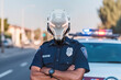 © ADDICTIVE STOCK - Portrait of a police robot in the street next to patrol car. Generative AI