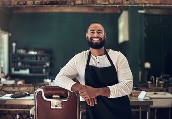 Barber shop, hair stylist and black man portrait of an entrepreneur with a smile. Salon, professional worker and male person face with happiness and proud from small business and beauty parlor
