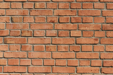  Brick wall. Brickwork from an old brick in a rustic style. Structure and pattern of the destroyed stone wall. Copy space