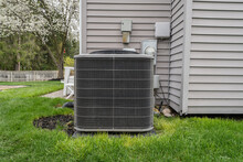 Air Conditioner Condeser Unit And System Has Been Installed In A Backyard