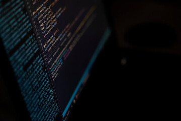Software source code. Program code. Code on a computer screen. The developer is working on program codes in the office. Photo with source code.