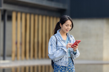 Sticker - Woman walk in the street with her phone