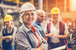 © ADDICTIVE STOCK - Generative AI illustration of cheerful mature female architect in hardhat smiling and looking at camera while standing with crossed arms against blurred colleagues during construction works