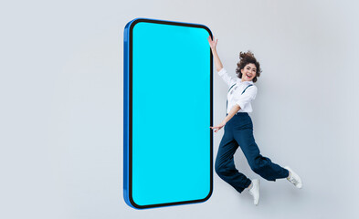 attractive asian lady jumping high up to present aplication on mobile