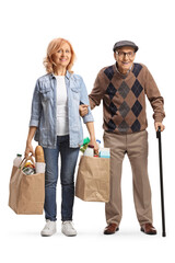 Wall Mural - Daughter helping her elderly father and carrying grocery bags
