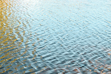 river surface texture, waves shining in the sun.