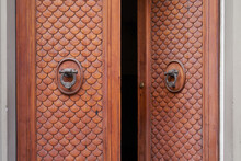 Old Opened Wooden Door With Bronze Knockers In Florence, Italy