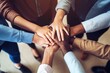 © id512 - Closeup shot of a group of unrecognizable business people joining their hands together in a huddle