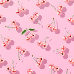 Trendy pattern composition made with Decorative disco balls like cherries on pastel pink background. Concept of minimal entertainment. Flat lai. Contemporary style. Creative art, minimal aesthetics.