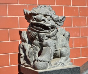 Wall Mural - Traditional guardian lion at a Chinese temple