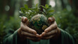 © Lee John - Protecting Our Planet, Hand Holding Earth Globe on Green Background