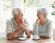 Happy senior couple, coffee and smile for morning breakfast, relationship or bonding together at home. Elderly man and woman smiling with drinking tea cup or mug in relax, conversation or retirement