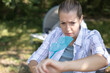 woman camper annoyed by flies