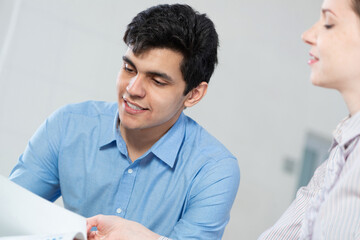 portrait of a young man at a business meeting