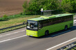 Green bus on the road